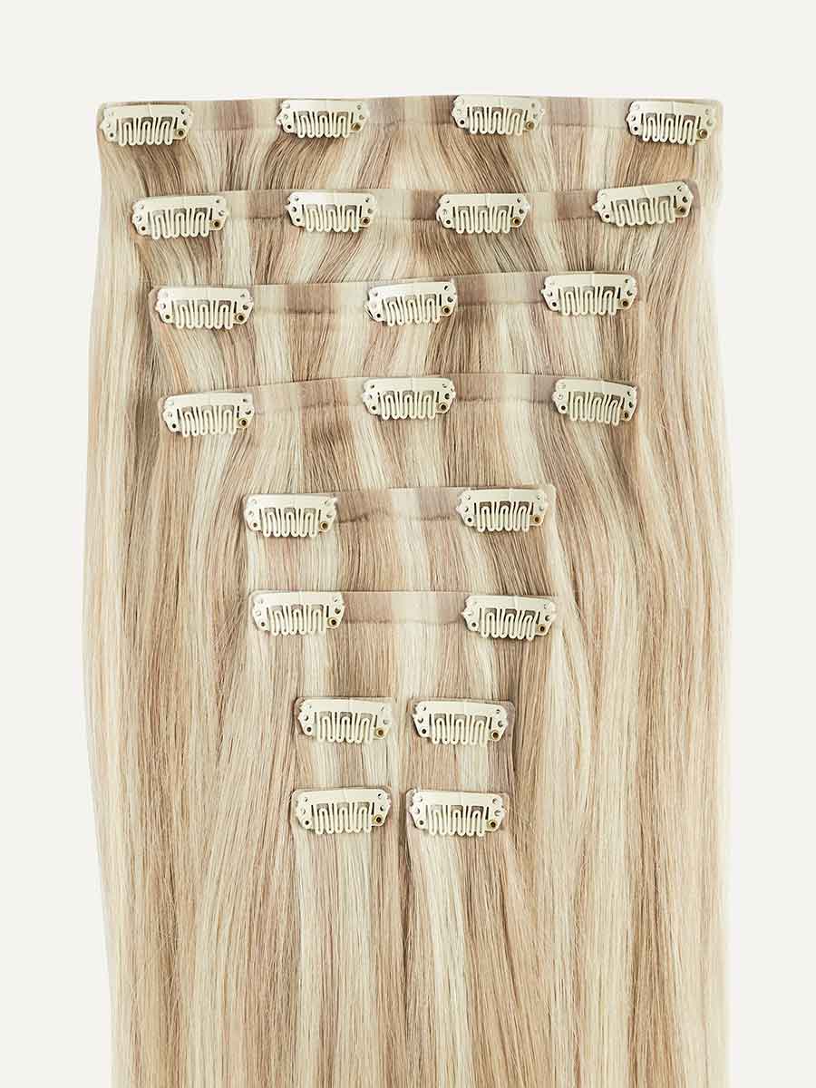 Blonde clip-in hair extensions for a seamless beige blonde balayage look by Luxy Clip Ins Hair Extensions.